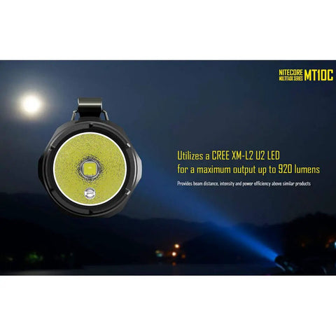 MT10C 920 Lumen Multitask Tactical Flashlight With Red Light and Beacon Mode shown in night landscape view
