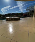 Real Deal Floor Sealer And Epoxy Topcoat That Refreshes And Beautifies Polished Concrete With A Knockout Flake Coating Built For Gritty Warehouse Jobs One Gallon Jug on polished concrete outdoors.