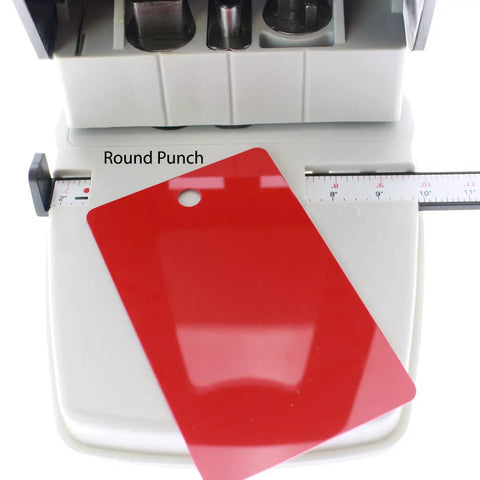 Three In One ID Card Hole Punch Tool For Name Badges with red PVC card in round punch slot, adjustable centering guide visible