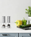 Touch Activated Automatic Electric Spice Grinder With Soft Glow LED Light Salt And Pepper Mill For Kitchen Countertop on a kitchen countertop.