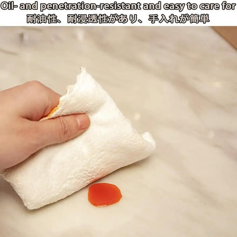Person wiping a sticky surface with a white cloth demonstrating heavy duty PVC floor protector mat for rolling chairs with slick glide.