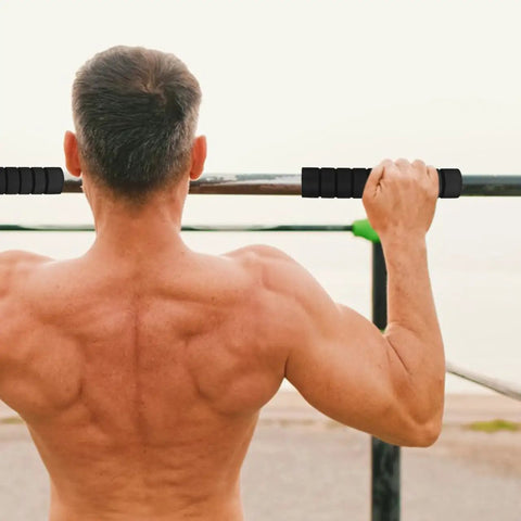 Man using Three Pack Pull Up Bar Grip Sleeves With Anti Slip Sponge Pads For Non Skid Hand Guards Removable And Washable Padding