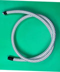 Coiled Replacement Steam Hose For Garment Steamer Pro Grade High Temperature Resistant Tube on green background
