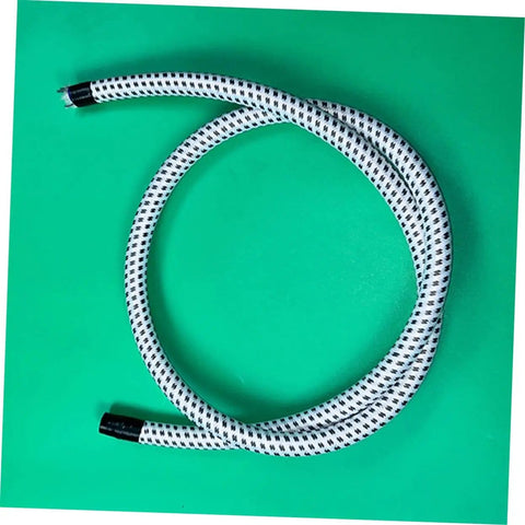 Coiled Replacement Steam Hose For Garment Steamer Pro Grade High Temperature Resistant Tube on green background