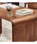 Kickass Executive Desk With Three Smooth Drawers And Raised Monitor Stand Perfect For Your Prime Home Office Or Gaming Rig In Rich Black Walnut Wood Finish 143 Cm Wide showing surface with pens and books.
