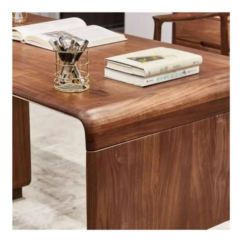 Kickass Executive Desk With Three Smooth Drawers And Raised Monitor Stand Perfect For Your Prime Home Office Or Gaming Rig In Rich Black Walnut Wood Finish 143 Cm Wide showing surface with pens and books.