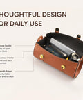 Open view of brown handlebar bag showing spacious interior with daily essentials, secure buckle, and smooth finish.