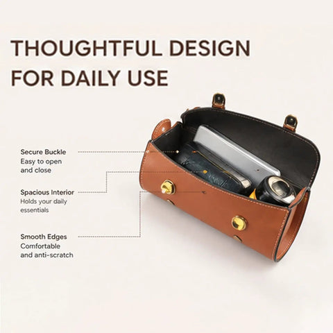 Open view of brown handlebar bag showing spacious interior with daily essentials, secure buckle, and smooth finish.