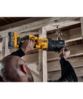Boss Level Brushless Cordless Power Drill 20 Volt Max Ready Half Inch Compact Stud And Joist Driver in use on wood framing.