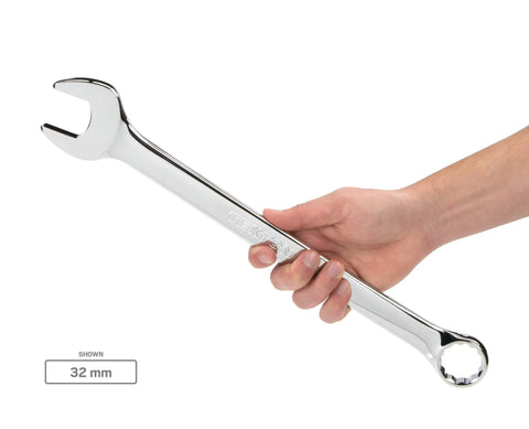 Person holding a chrome wrench from the 46-Piece Combination Wrench Set With 19 Inch Wrenches And 27 Metric Wrenches, size 32mm.