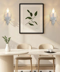 ZIRALIO Farmhouse Vintage Wall Sconce for Bedroom, 2-Pack illuminating a dining area with a wooden table and plant decor.