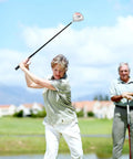 Woman teeing off with Women's 460cc Golf Driver With Graphite Shaft, Lightweight Right-Handed Single Club With Head Cover