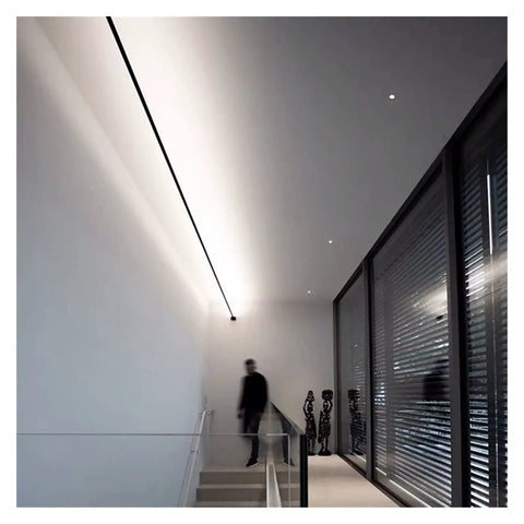 Effortlessly Sleek Modern Linear LED Wall Sconces With Remote Control For Cozy Bedroom And Living Room Vibes A Total Game Changer For Your Glow Up In Black Finish Dimmable Lighting illuminating a modern staircase.