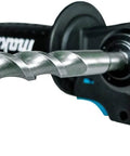 Makita SDS-Plus carbide-tipped drill bit in rotary hammer drill, close-up view