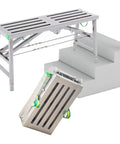 Top Shelf Folding Work Platform And Scaffold Tower With Adjustable Height, steel frame, shown folding to fit stairs.