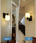 Chill Out Matte Black Milk Glass Wall Sconces Bringing Soft Warm Light To Your Space Premium Metal Build Rust Resistant Finish Dead Simple Hardwired Wiring Ceramic E26 Socket mounted on wall, shown in two positions.