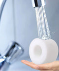 Rinsing a foam filter under water, part of the Four Pack Foam And Felt Filters For APEX UpLight DuoClean Vacs LZ600 LZ601 LZ602 LZ602C