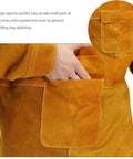 Close-up of hand using pocket on Leather Welding Apron With Sleeves Heavy Duty Welder Jacket Heat And Flame Resistant For Men.