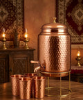 Copper Hammered Water Dispenser Tank With Tap, 6.5 Liter Capacity, Pure Copper Interior, with four copper glasses, on table