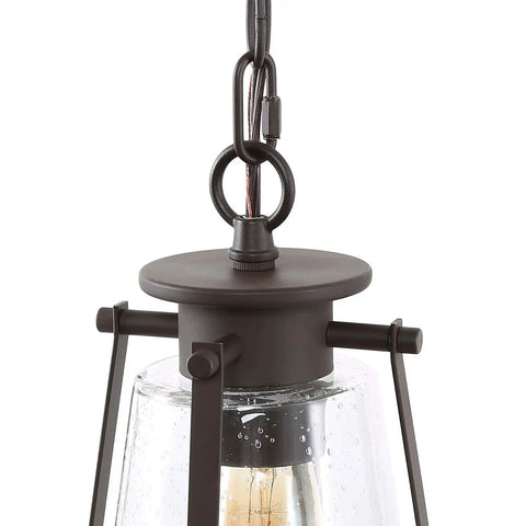 Close-up of Modern Farmhouse Pendant Light For Kitchen Island In Bronze Finish With Seeded Glass Shade hanging mechanism