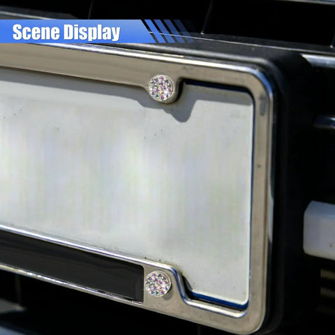 Fly Bling Rhinestone License Plate Screw Kit With Anti Theft Caps and Dope Sparkly Bolts For Truck Suv Car Exterior Rides close-up of rhinestone screws on a vehicle license plate.