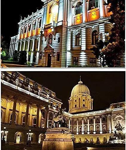 Beautifully illuminated historic buildings at night, showcasing architectural details and vibrant lighting.