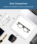SOLWST Optix anti-fog lens wipes packet on a desk beside eyeglasses, laptop, phone, and camera lens