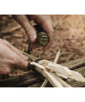 Using Rip Spool Field Repair Kit Orange for quick outdoor fixes in a survival situation, includes durable tools for emergency use