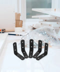 Heavy Duty L Shaped Corner Brackets 12 Pack Stainless Steel Right Angle Braces Black on table for DIY support