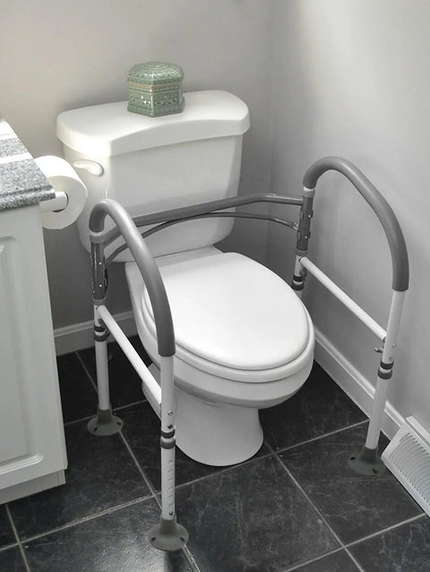 Deluxe Adjustable And Foldable Toilet Safety Frame With Handrail Grab Bar For Seniors installed on white toilet