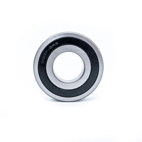 Solid Heavy Duty Front Load Washer Tub Bearing And Seal Kit Replacement For Frigidaire Kenmore Crosley black and silver bearing close-up.