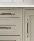 10 Pack 3 Inch Knurled Brushed Antique Copper Cabinet Drawer Pulls installed on white kitchen cabinets