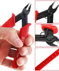 Pro Grade Flush Cutter Wire Cutters With Anti Slip Handles held in hand, close-up of cutting edges and red anti-slip grips