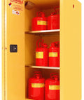 Heavy Hitter Flammable Storage Cabinet Featuring 60 Gallons And Smooth Self Closing Sliding Door For Zero Hassle Industrial Chemical Storage Plus FM Approved And OSHA Compliant Yellow Construction with red containers inside.