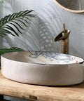 USZWBY Vessel Vanity Sink Basin Hand Painted Wash Basin Modern Countertop with Drain Faucet for Bathroom Balcony Simple Home Sink oval basin on wooden surface with faucet.