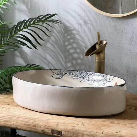 USZWBY Vessel Vanity Sink Basin Hand Painted Wash Basin Modern Countertop with Drain Faucet for Bathroom Balcony Simple Home Sink oval basin on wooden surface with faucet.