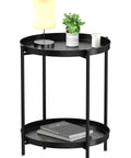 2 Tier End Table With Removable Tray, Metal Side Table For Living Room, Bedroom, Balcony, Patio Or Office, Waterproof, Sturdy And Versatile, Compact Coffee Table For Indoor Outdoor Use, Black with lamp, plant, and book on top tier.
