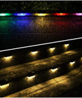 Color-changing and warm white Solar Deck Lights 12 Pack Outdoor Waterproof LED illuminating stairs and fence at night