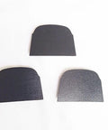 Three black trapezoidal diamond discs for concrete mastics glue and paint removal on Lavina Onfloor and EDCO Magnatrap grinding machines.