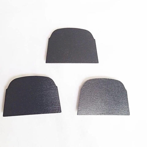 Three black trapezoidal diamond discs for concrete mastics glue and paint removal on Lavina Onfloor and EDCO Magnatrap grinding machines.