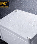Rock Solid Electrical Junction Box With IP67 Waterproof Rating, Heavy duty plastic enclosure with water droplets.