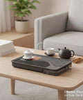 Zero Drip Drama Gongfu Tea Station Serving Tray With Imitation Ebony Stone Finish And Smart Catch Basin Design Keeping Your Living Room Setup Totally Stress Free All Day on a wooden table with tea items.