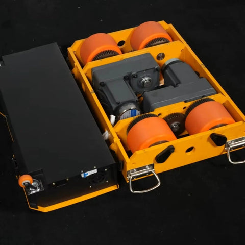 Heavy Duty Battery Powered Machinery Transport Dolly With Wireless Remote Control That Picks Up Massive Loads In Beast Mode showing top view of internal components and wheels.