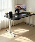 Rock Solid Dual Motor Electric Standing Desk With Smooth Height Adjustable Sit And Swap Frame in modern office setup with monitor.