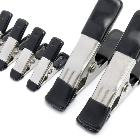 Angled view of Amazon Basics steel spring clamp set: eight clamps with black PVC-coated tips and silver bodies