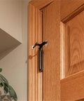 Durable Oil Rubbed Bronze Hinge Pin Door Stops 5 Pack Zinc Alloy Adjustable 85 to 125 Degrees Fits Quarter To Five Sixteenths Inch Pins Two And A Half Inch Wall Protection For Home Hardware installed on wooden door