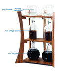 Heavy Duty Dutch Cold Brew Coffee Maker With Solid Wood Tower And Stainless Steel Filter brewing coffee with clear water and beans.