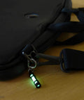Embrite Glow Fob With Green Embrite Pellet, Aircraft-Grade Aluminum Keychain Accessory For Everyday Carry on black bag