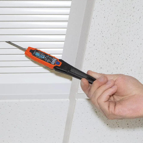 Hand using Handy Digital Pocket Thermometer for HVAC and Home Use, Instant Read With Backlit Display on air vent