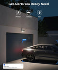 Slick 4K PoE Outdoor Security Camera Duo With Tough Built In Led Floodlight captures vehicle near garage door at night.
